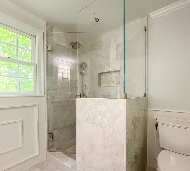 Historic home remodel Marble walk-in shower with built-in niche and glass door – luxury bathroom remodel in Beverly, Massachusetts